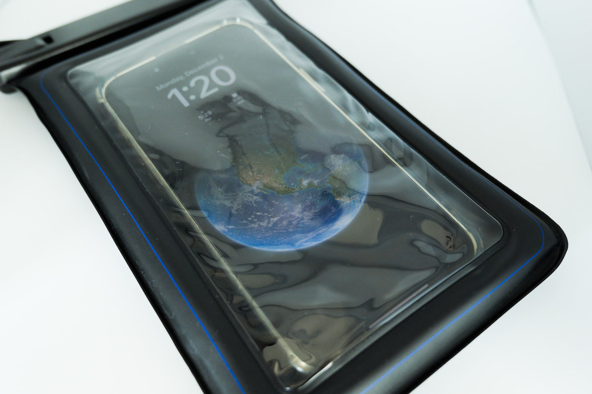 Phone inside the Sauna Safe Case, lock screen showing through