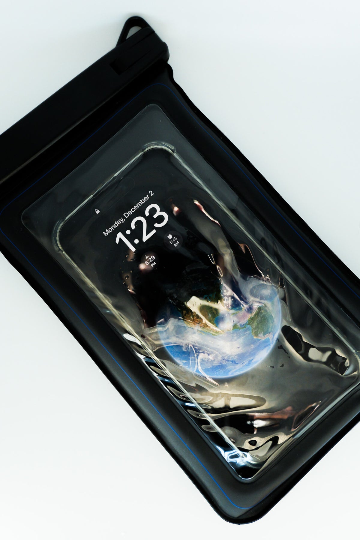 Phone inside the Sauna Safe Case, screen showing through